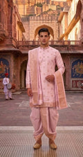 Elegant Pastel Pink Brocade Silk Kurta with Matching Dhoti and Ornate Gold Zari Shawl