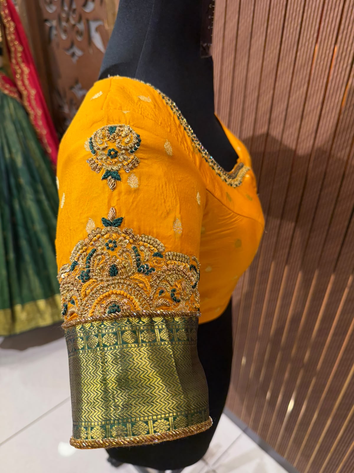 Vibrant Mustard Yellow Silk Designer Blouse with Contrasting Green Kanjeevaram Brocade Border and Zardozi Work