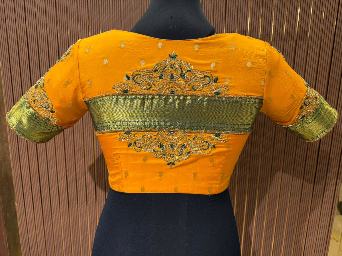 Vibrant Mustard Yellow Silk Designer Blouse with Contrasting Green Kanjeevaram Brocade Border and Zardozi Work