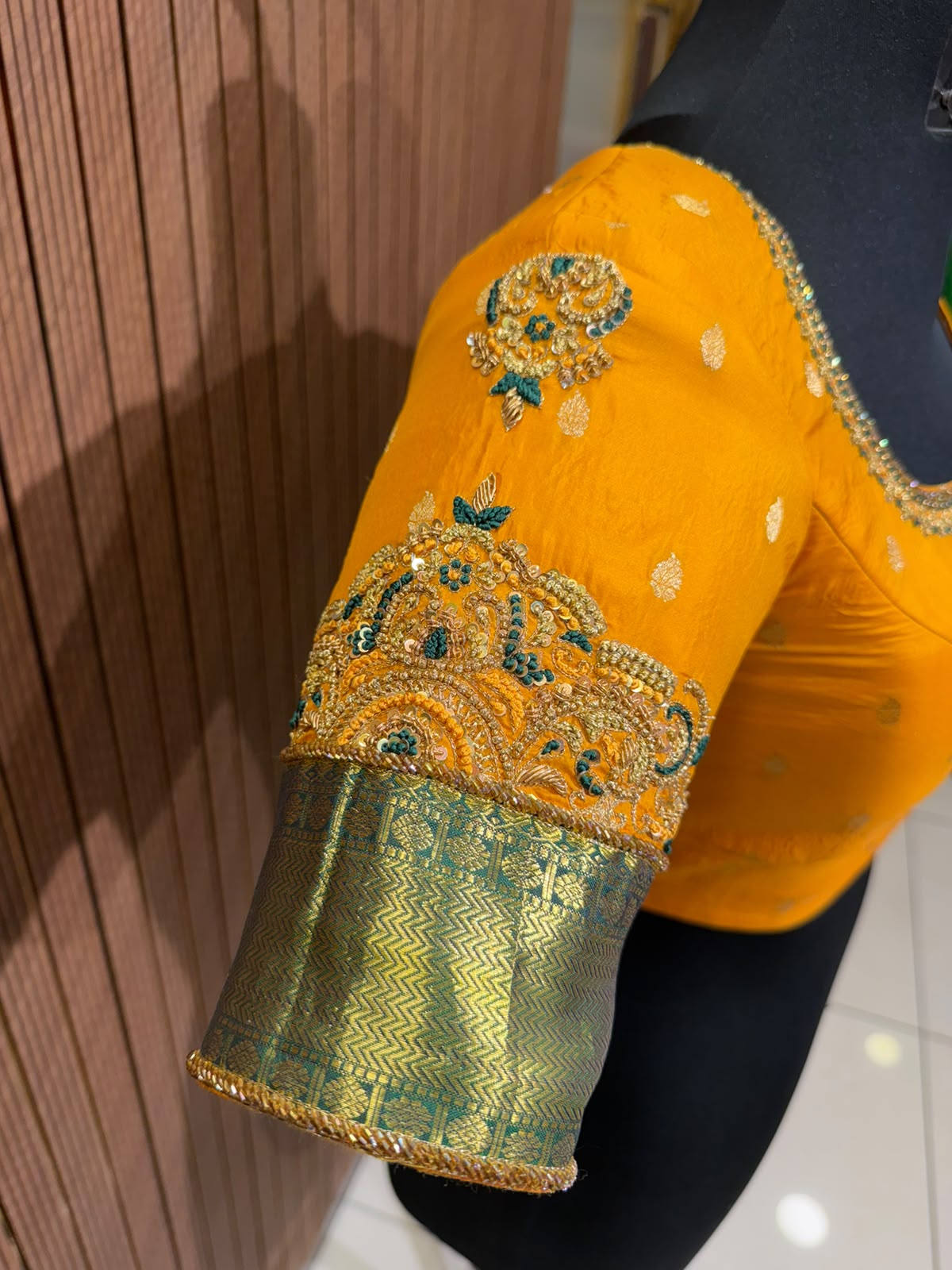 Vibrant Mustard Yellow Silk Designer Blouse with Contrasting Green Kanjeevaram Brocade Border and Zardozi Work