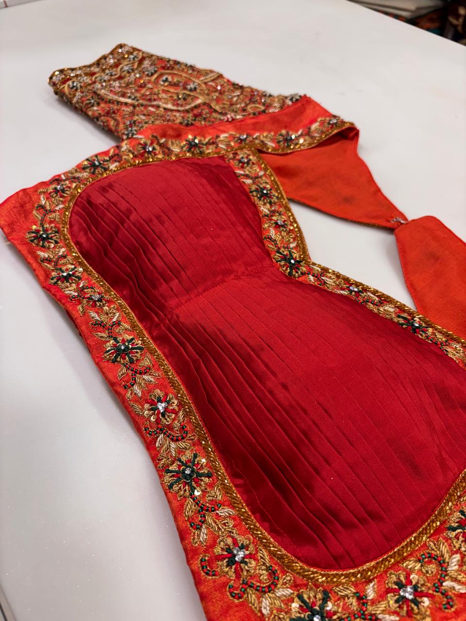 Opulent Vermilion Red Designer Blouse with Pleated Bodice and Heavy Zardozi Hand-Embroidery