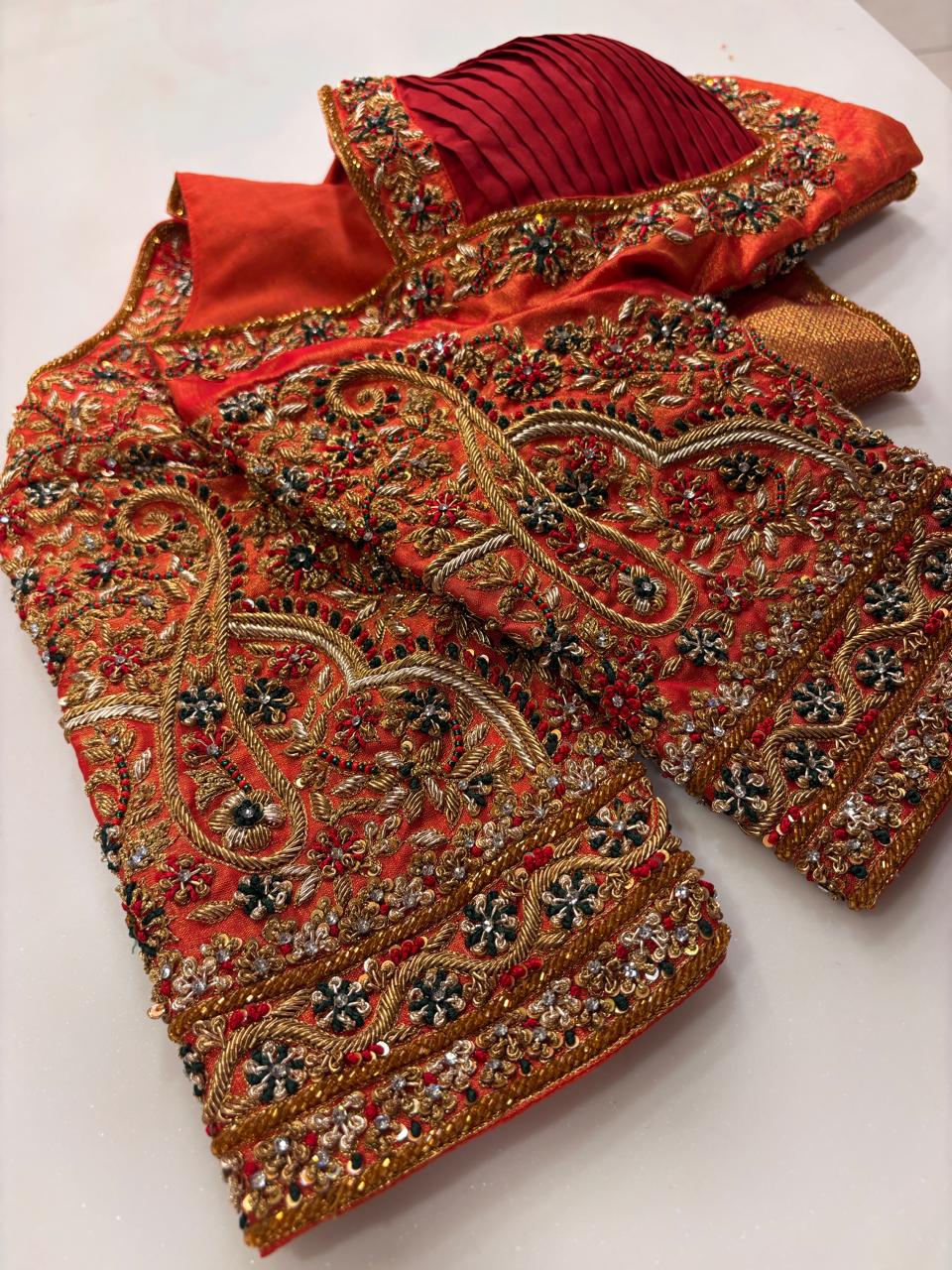 Opulent Vermilion Red Designer Blouse with Pleated Bodice and Heavy Zardozi Hand-Embroidery