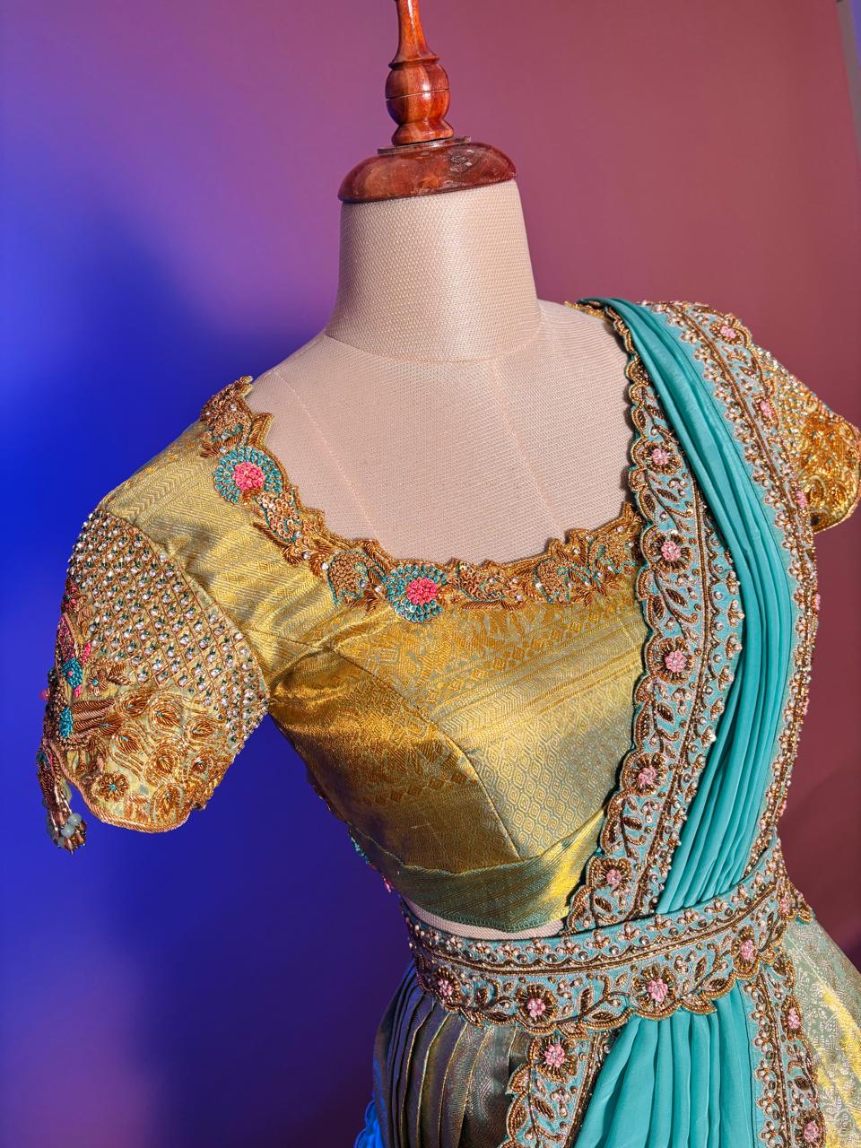 Opulent Gold and Turquoise Langa Voni Set with Intricate Zardozi and Floral Hand-Embroidery