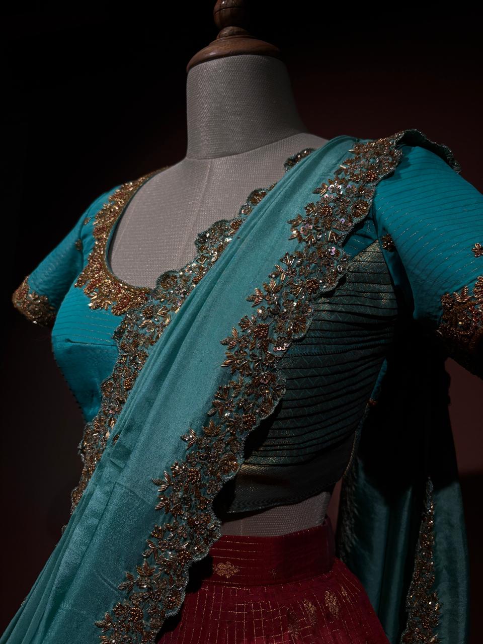 Regal Maroon and Turquoise Brocade Langa Voni Set with Intricate Zardozi and Sequin Embroidery